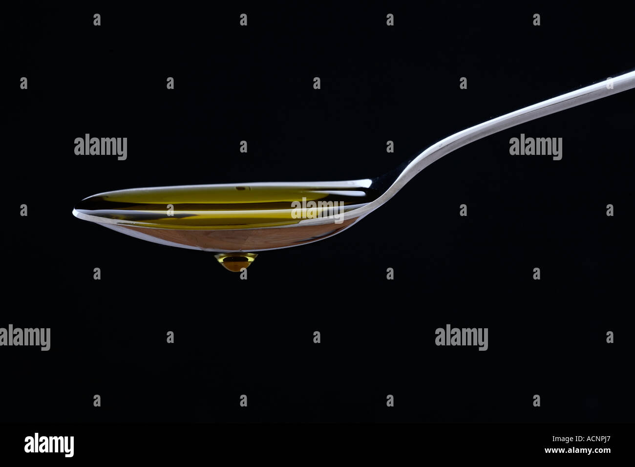 Spoon of olive oil Stock Photo Alamy