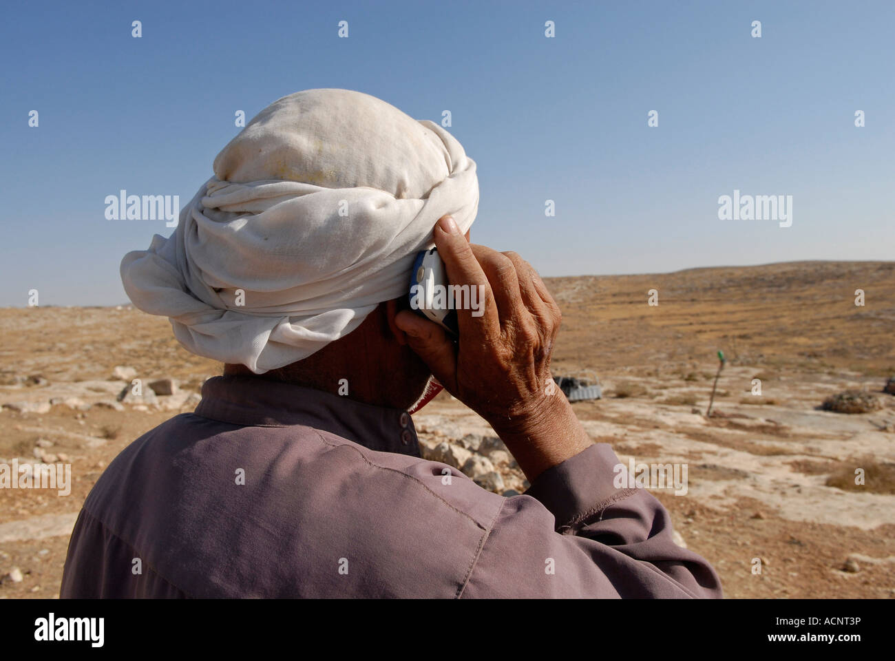 Palestinian man using mobile phone South Hebron hills, West Bank. Israel Stock Photo
