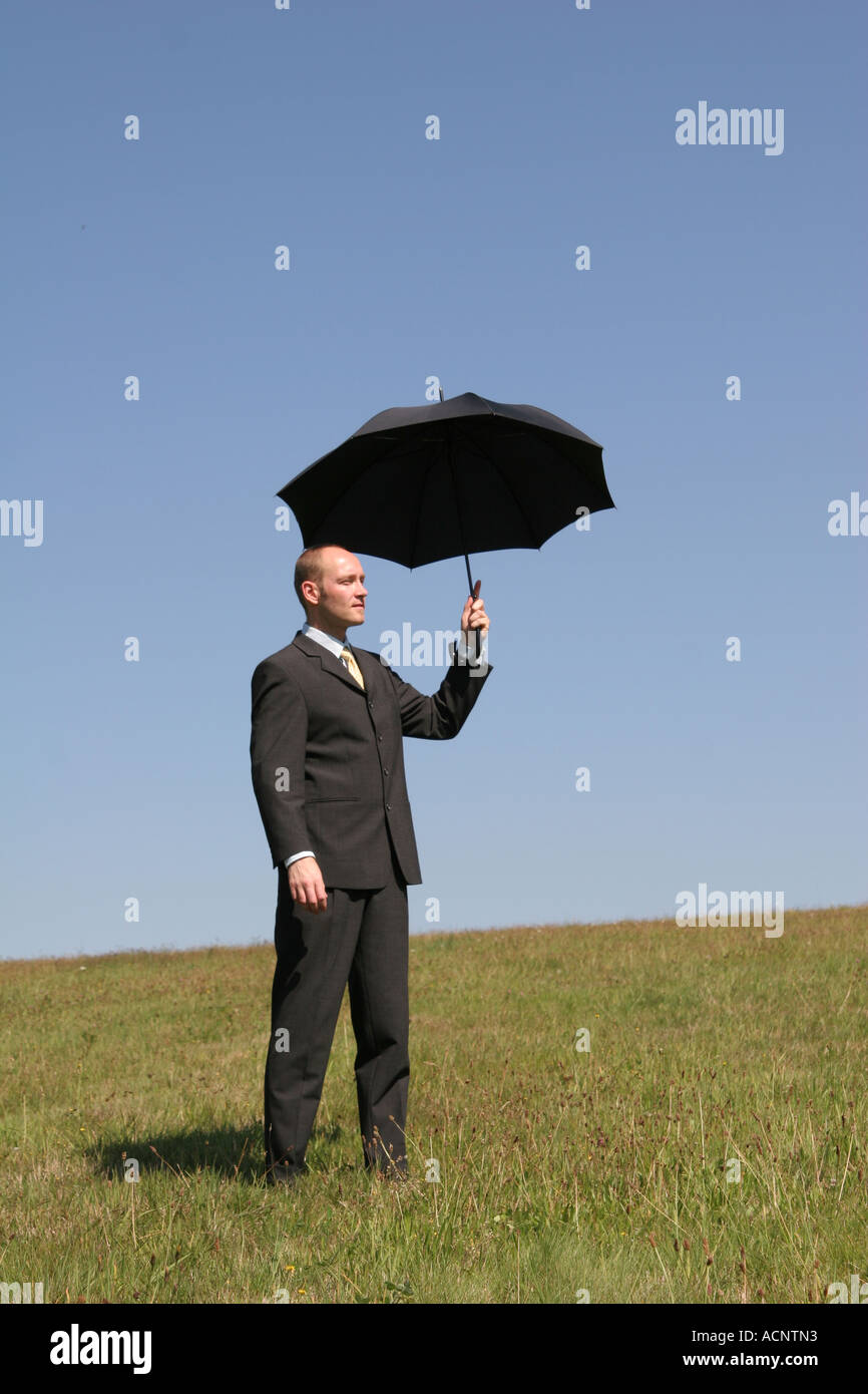 Man with a umbrella - Geschäftsmann mit Regenschirm Stock Photo