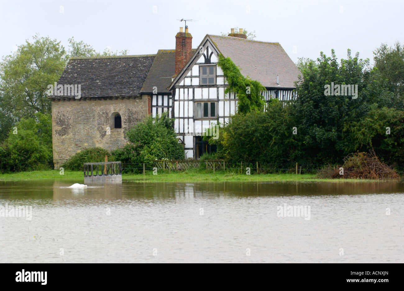 Oddas Chapel at Deerhurst Gloucestershire England UK cut off by the rising flood waters of River Severn Stock Photo