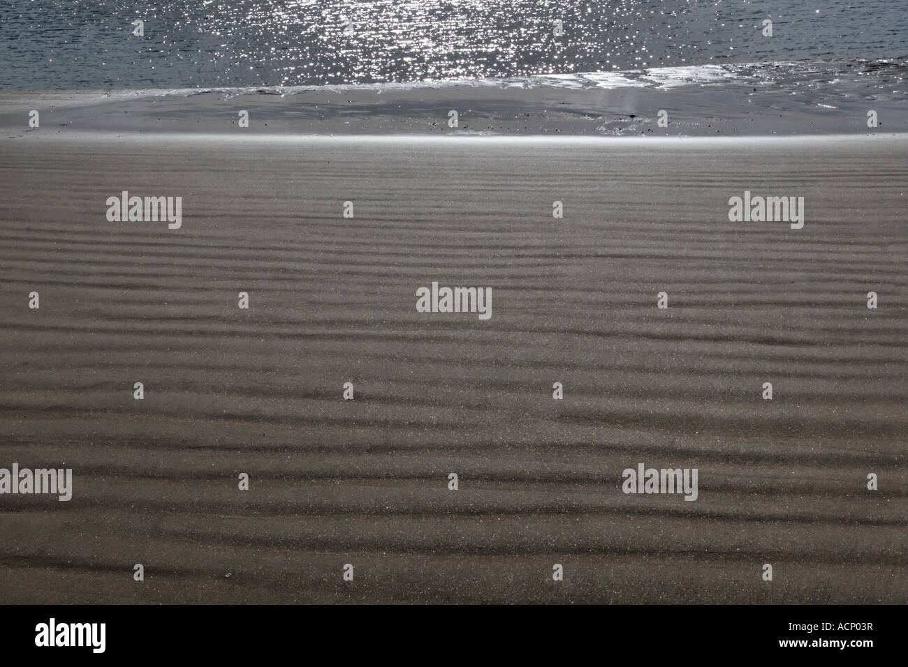 Dusk on dark sand beach hi-res stock photography and images - Alamy