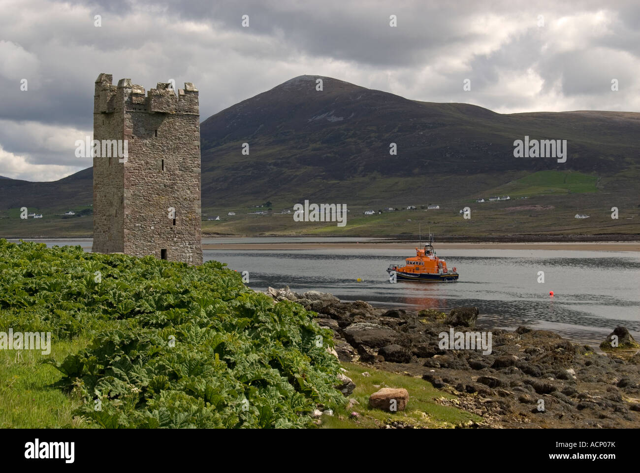 Carrick Kildavnet Castle and lifeboat, Achill Island, County Mayo, Ireland. Stock Photo