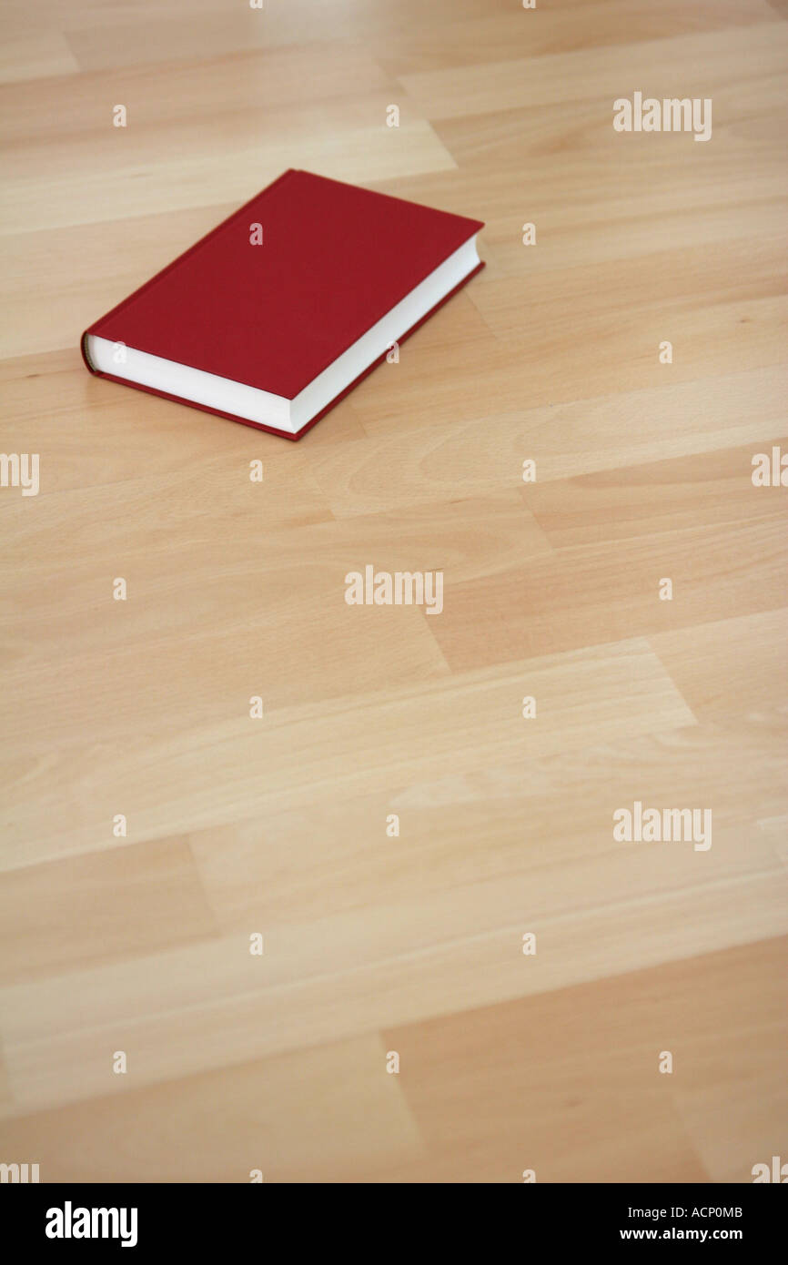 Book on wooden floor - Buch auf Holzboden Stock Photo