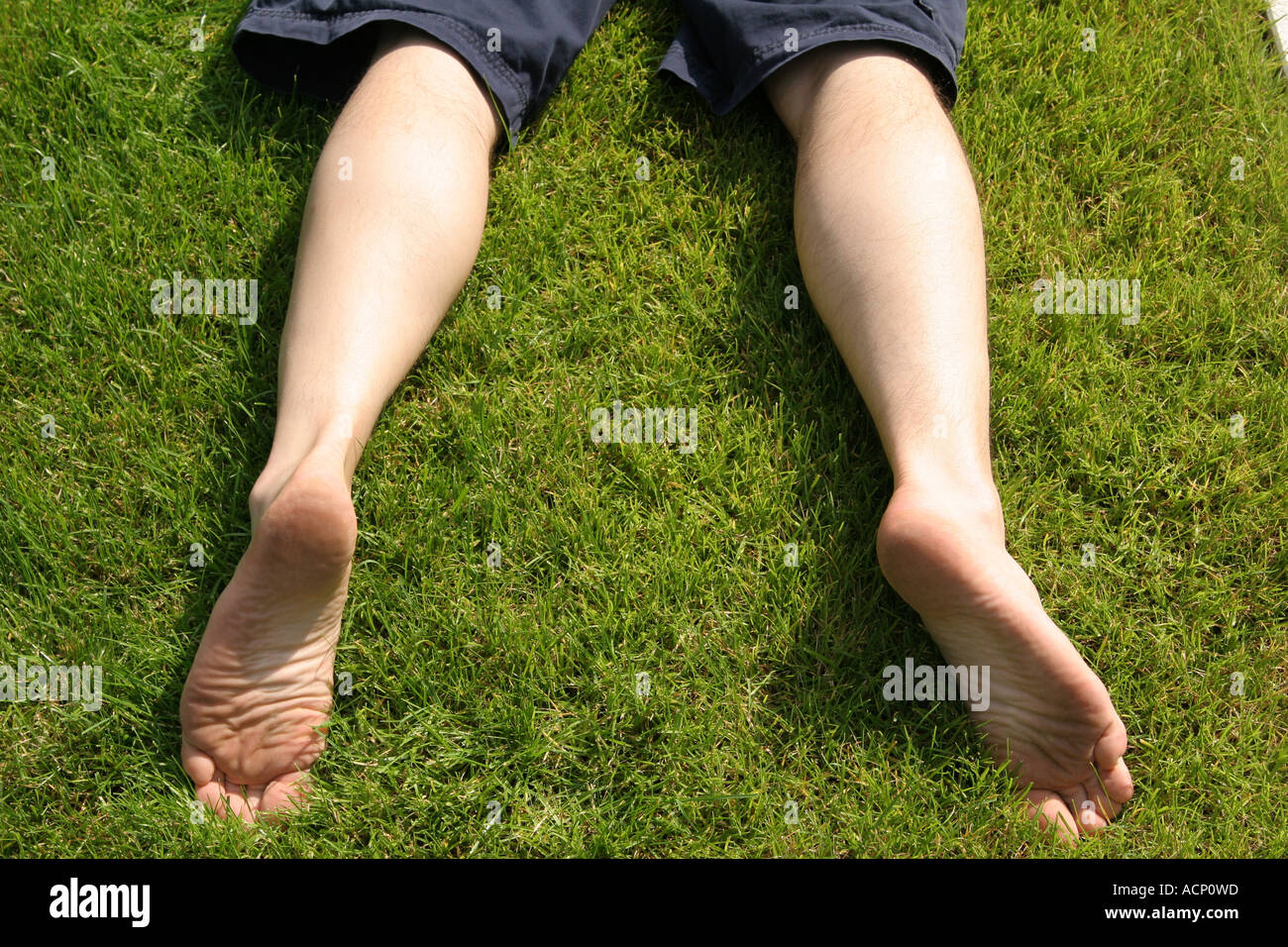 Legs on the grass - Beine auf dem Rasen Stock Photo