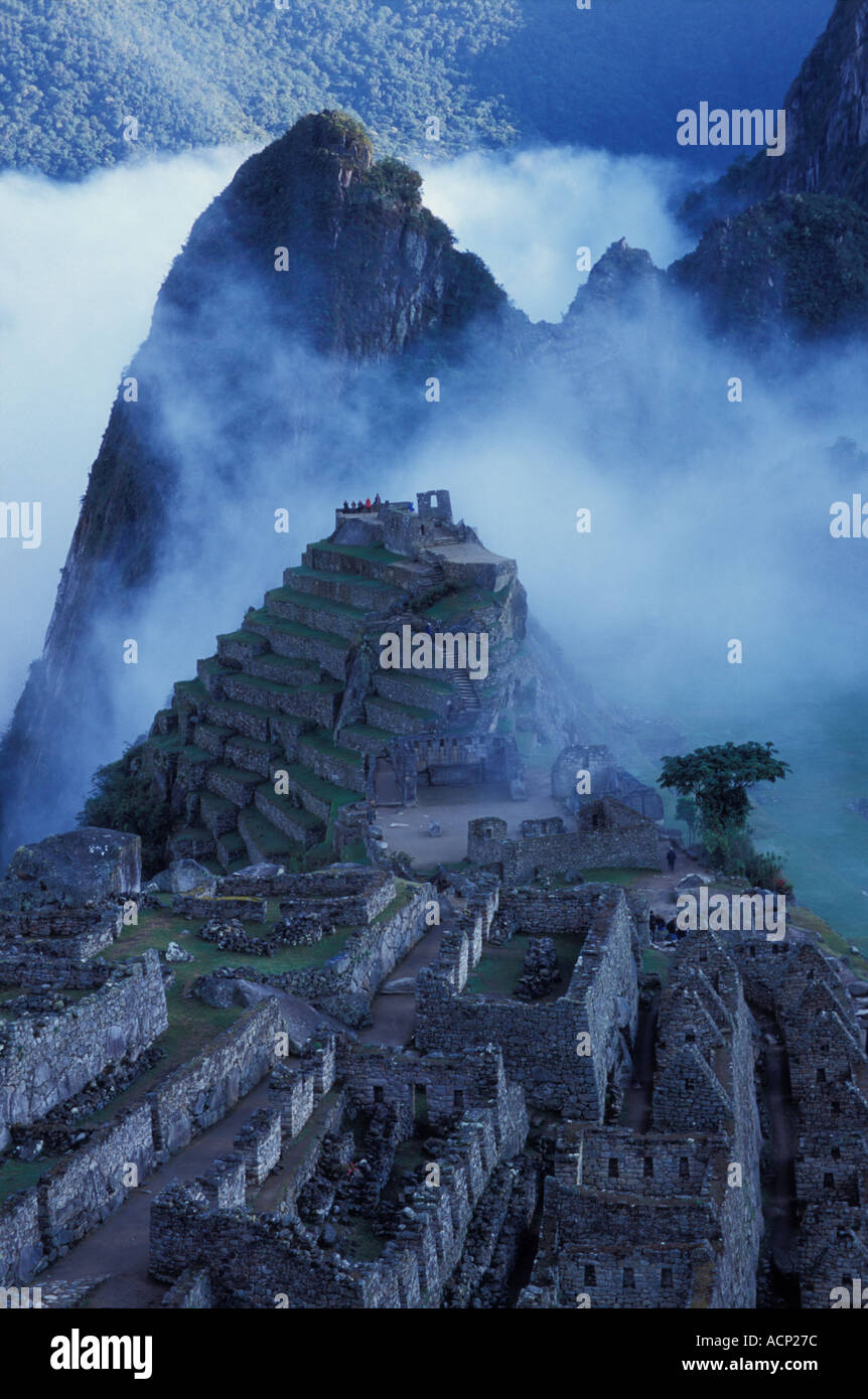 Ancient ruins of Machu Picchu with the Andes Mountains in mist Peru ...