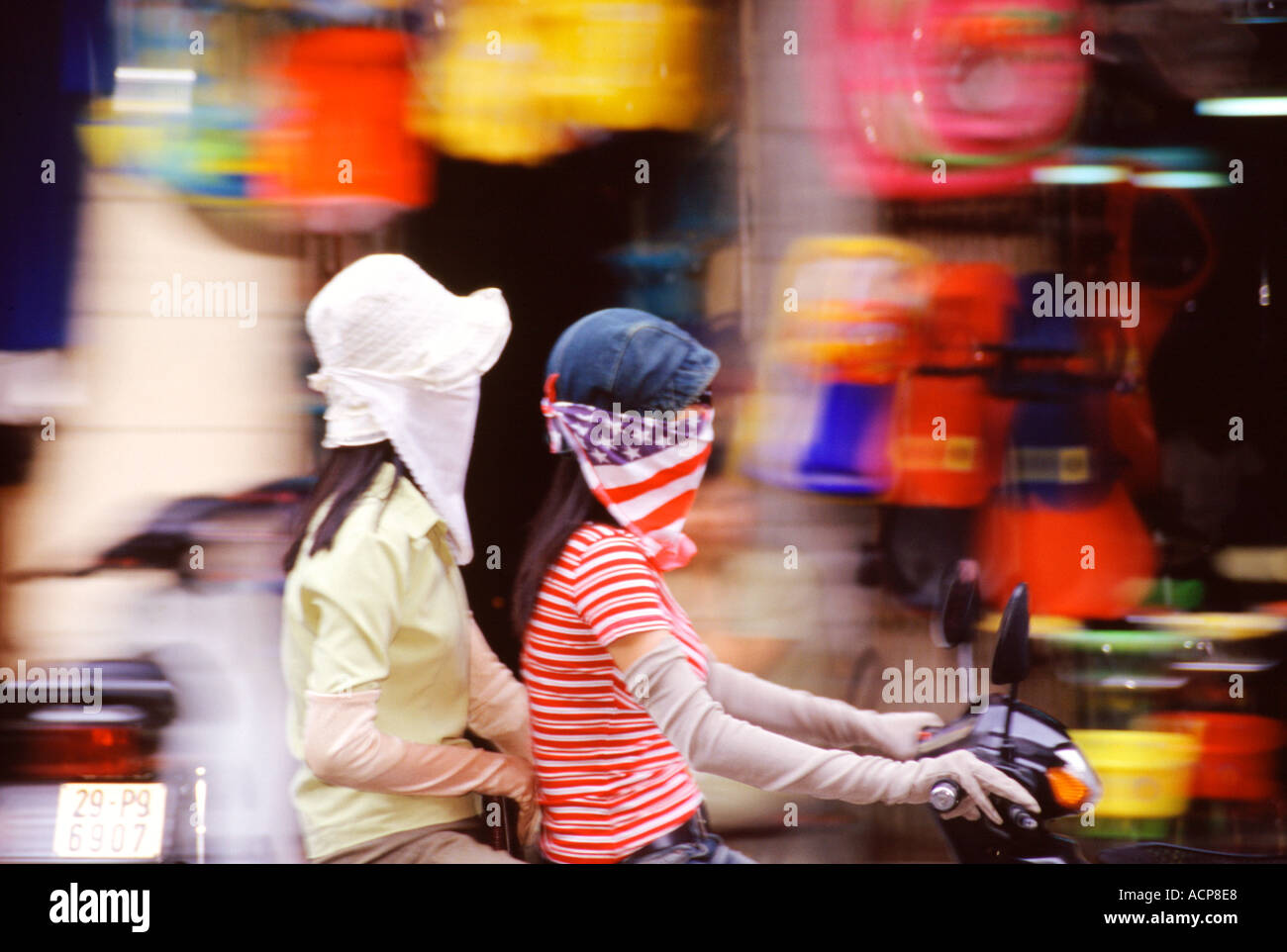 Girl riding a motor bike in Vietnam Stock Photo - Alamy