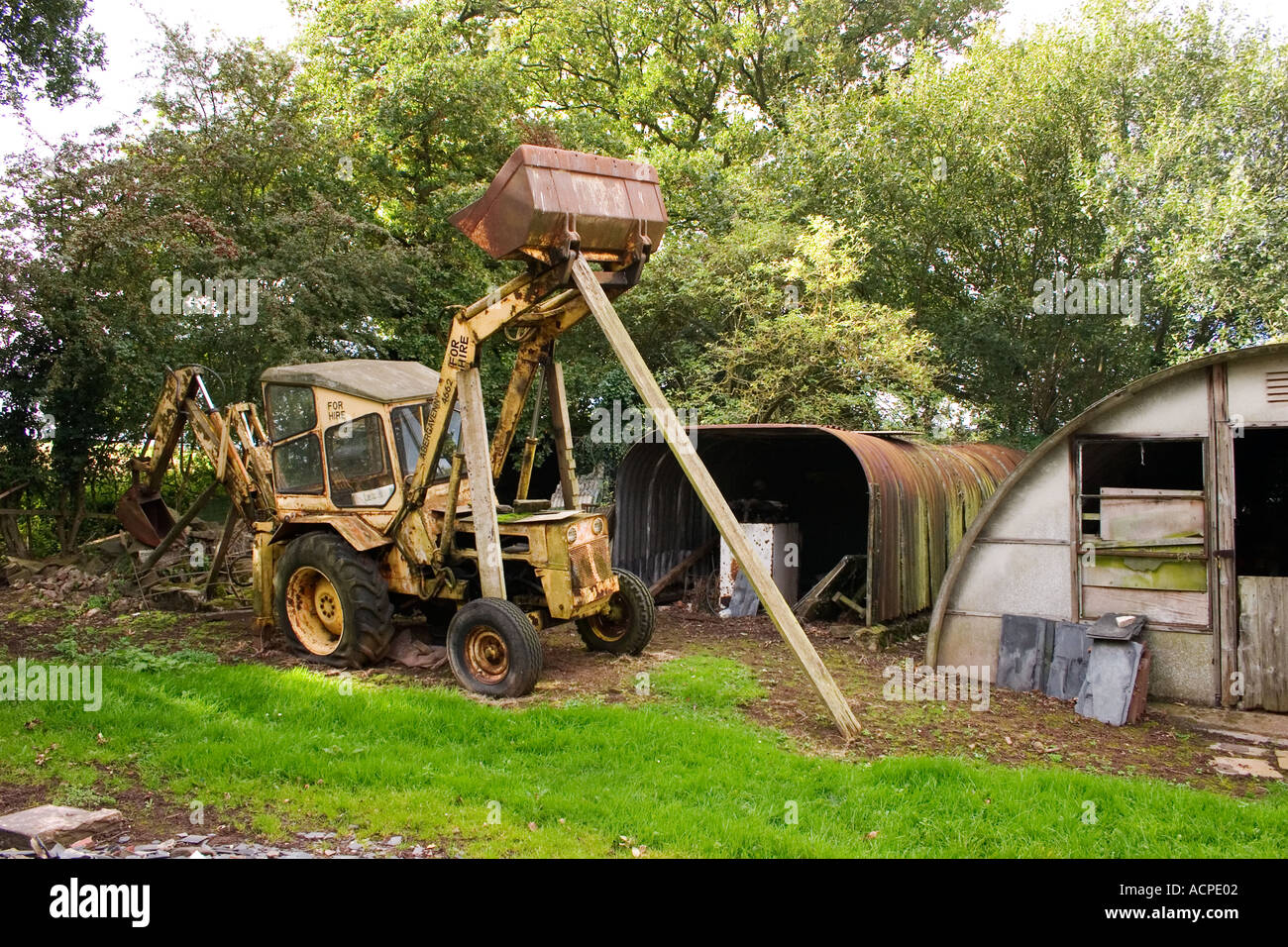 Decrepit Rig Decrepit mechanical digger in rundown farmyard Stock Photo - Alamy