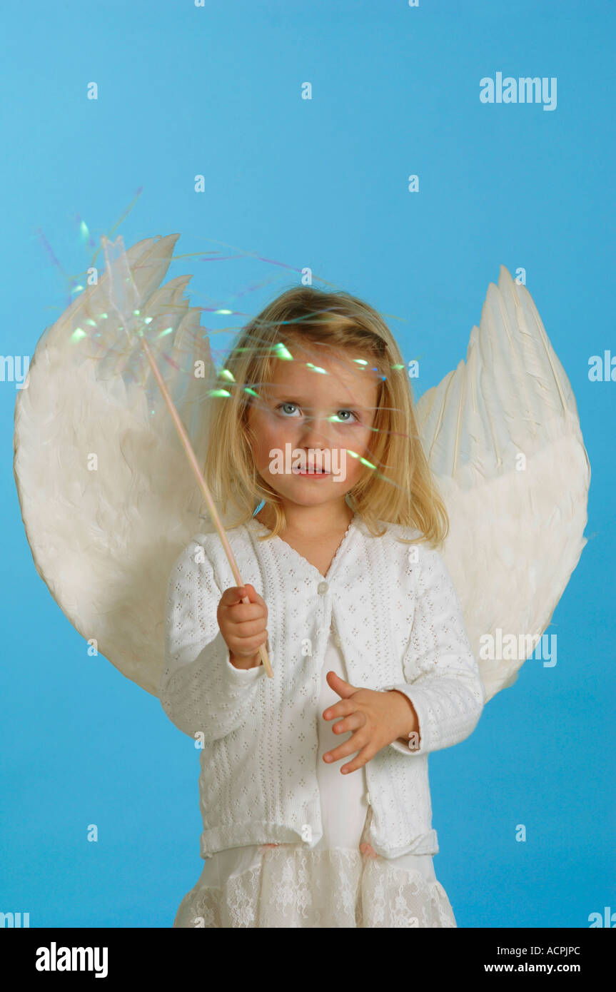 Girl (3-4) dressed in angel's costume Stock Photo
