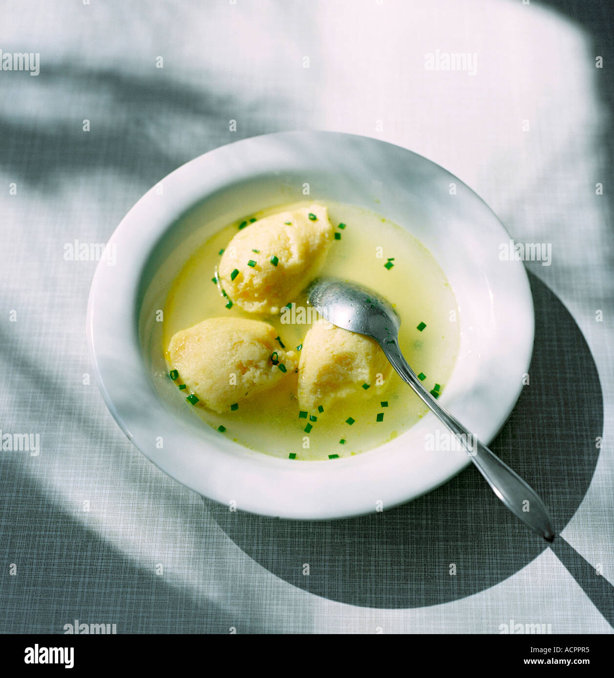 Soup with small semolina dumplings Stock Photo