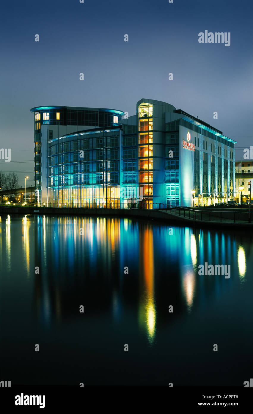 Night view with reflection of the London Ramada ExCel Hotel in London Docklands. Stock Photo