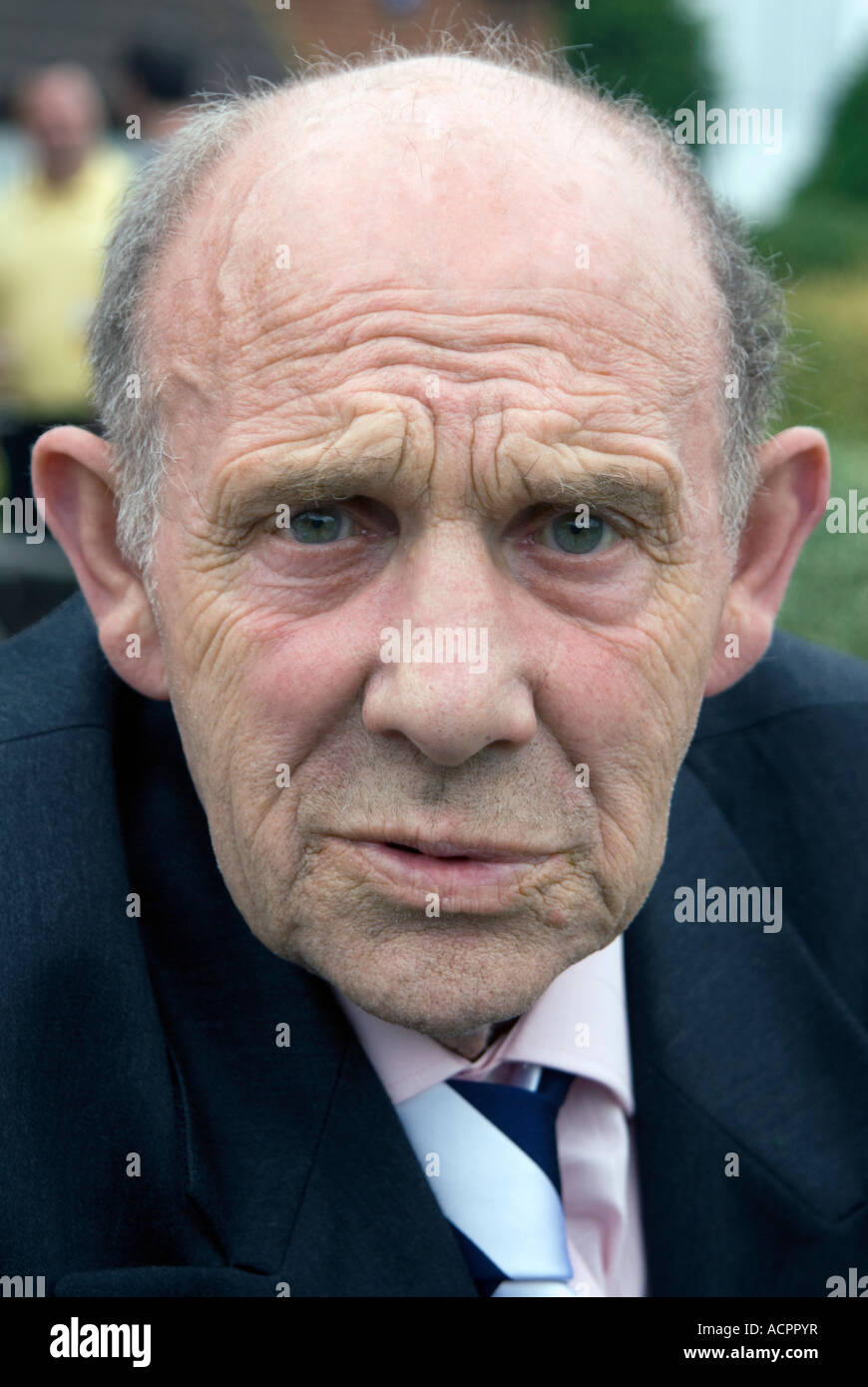 Interesting expression on the face of an old man Stock Photo - Alamy
