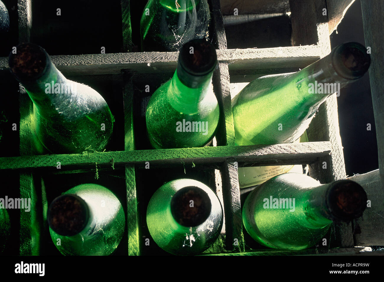 Close up on old bottles in bottle locker Muscatel Sauvion Fils Cleray castle Stock Photo