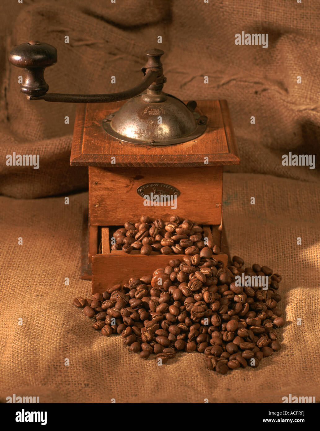 Coffee mill coffee beans on a gunny Stock Photo Alamy