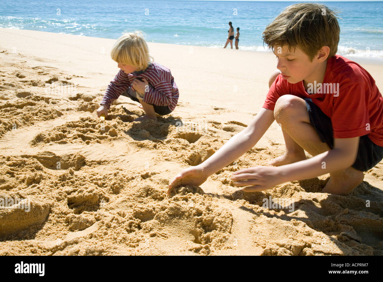 Portugal, Algarve, boys playing on beach Stock Photo Alamy