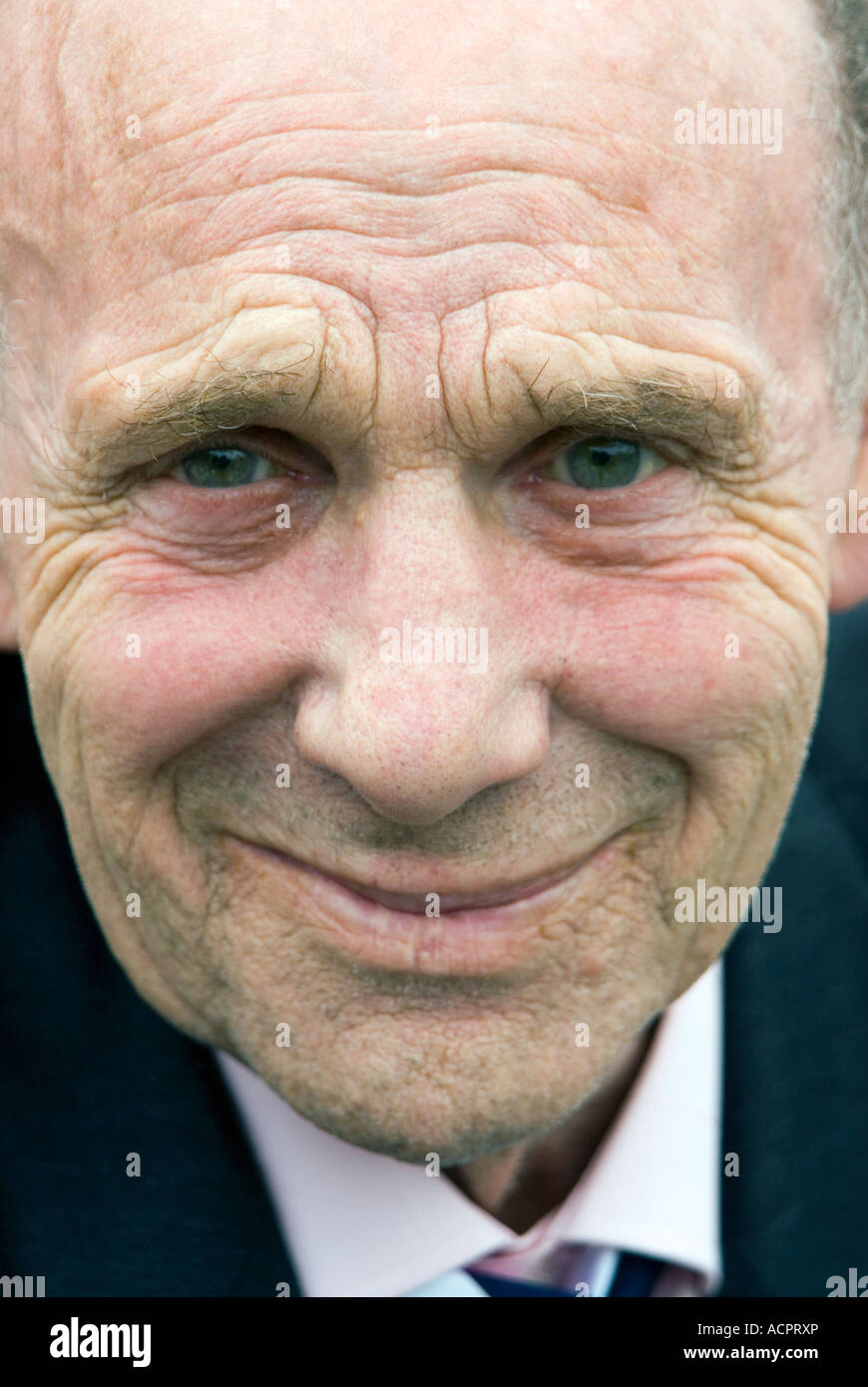 Interesting expression on the face of an old man Stock Photo