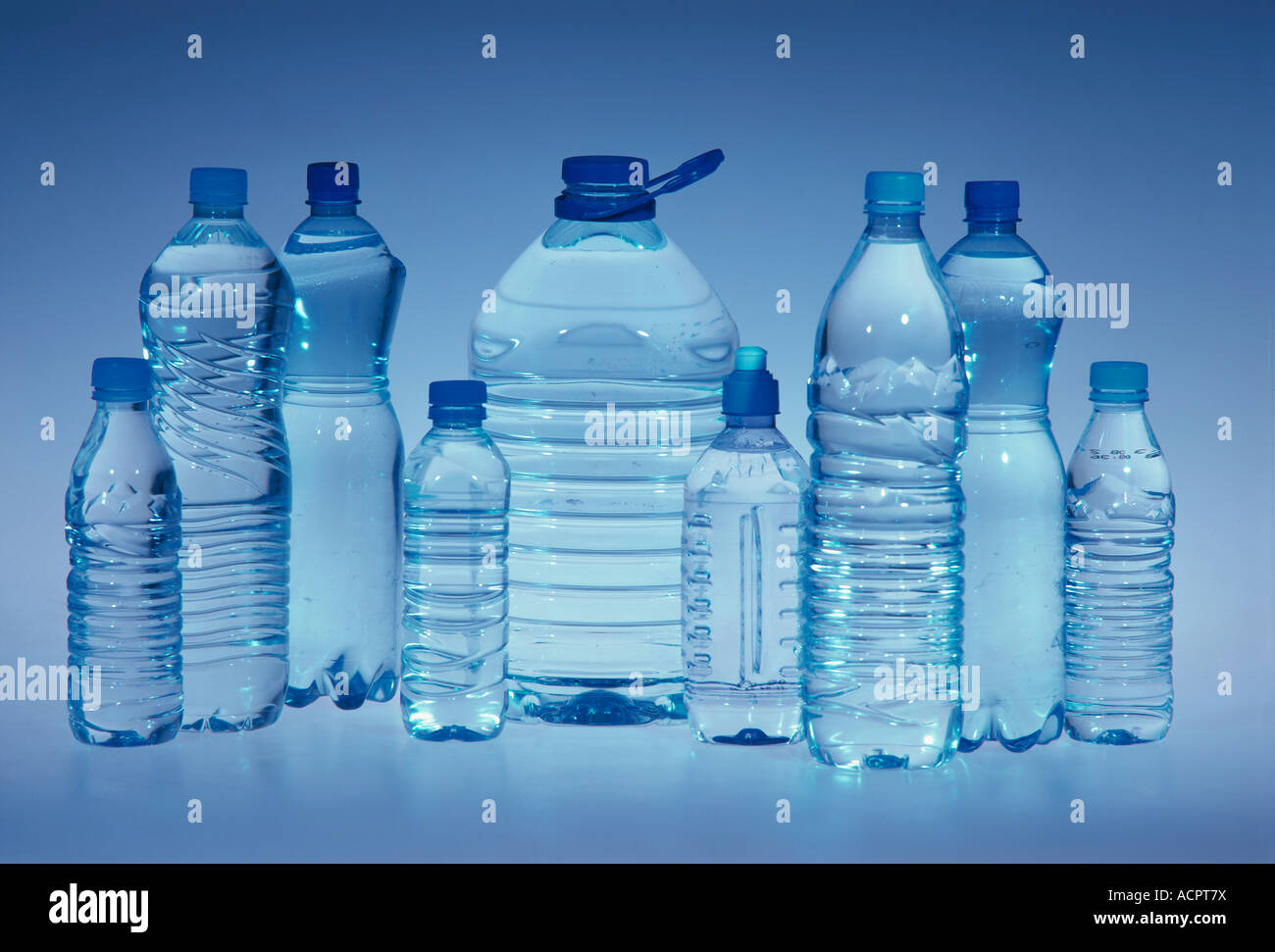 https://c8.alamy.com/comp/ACPT7X/9-plastic-bottles-of-water-with-different-size-grey-background-ACPT7X.jpg
