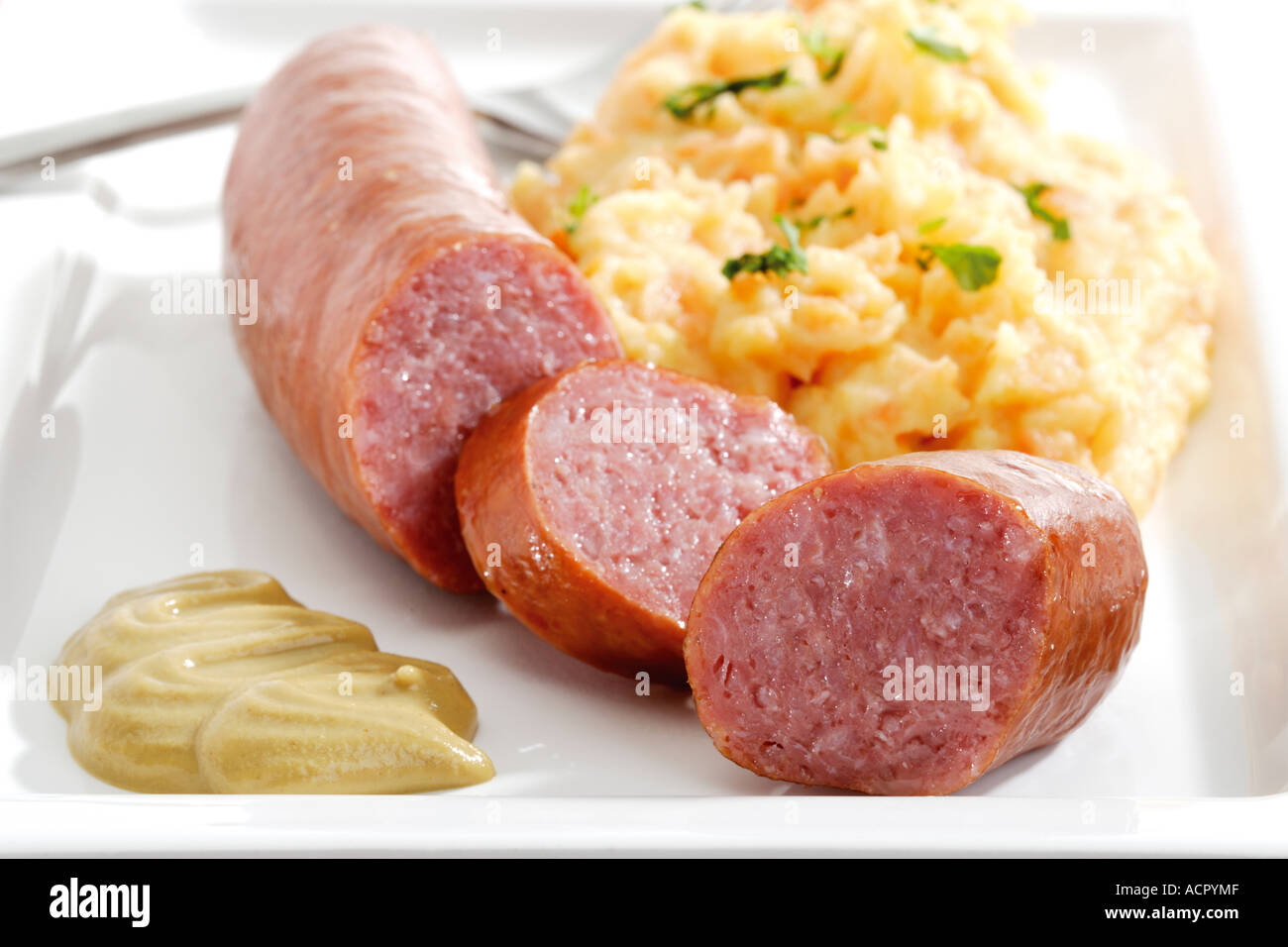 Minced meat sausage with potato-carrot puree Stock Photo