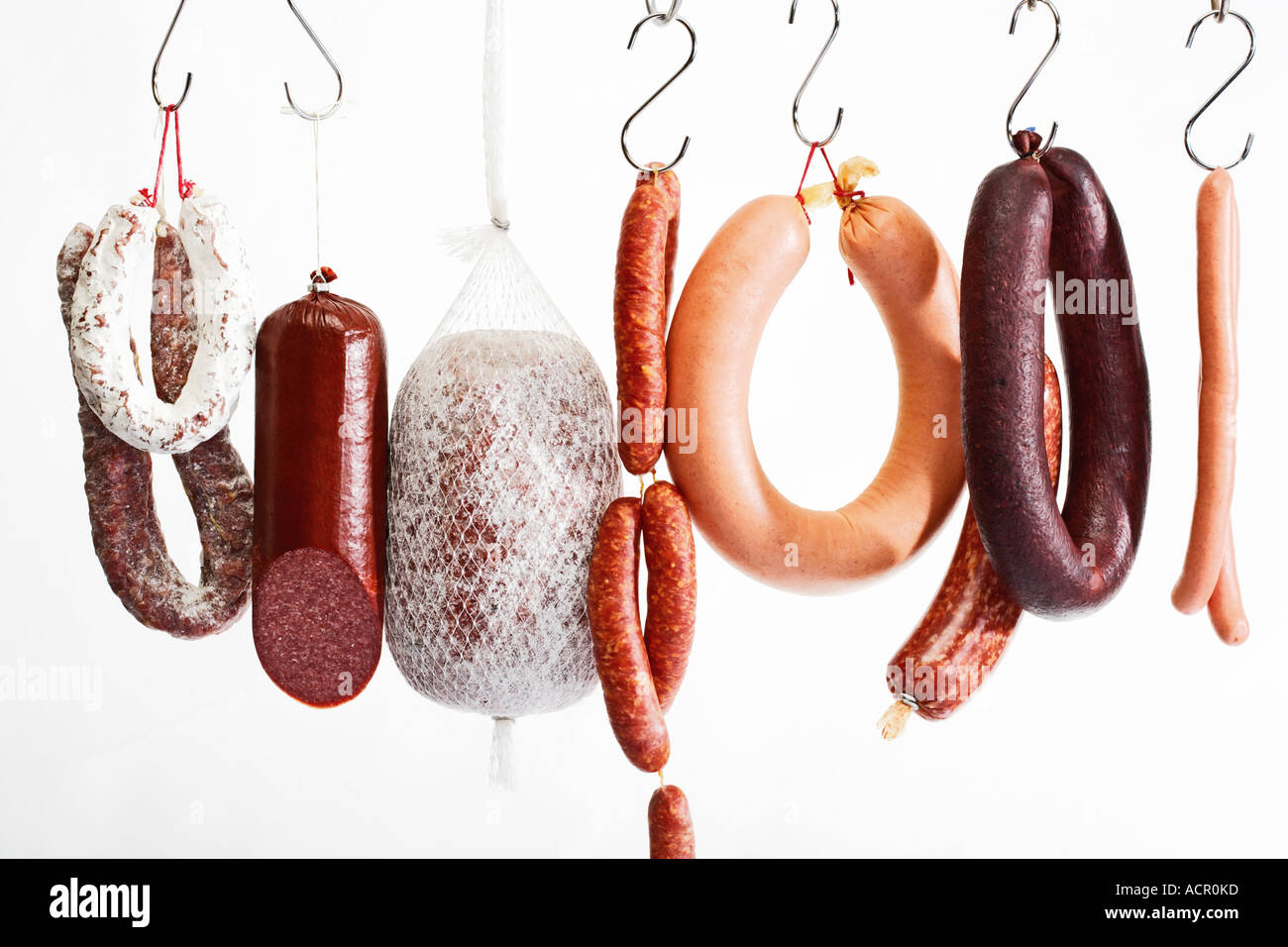 Sausages hanging on hooks Stock Photo