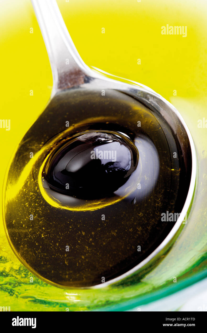 Black olive on spoon Stock Photo Alamy