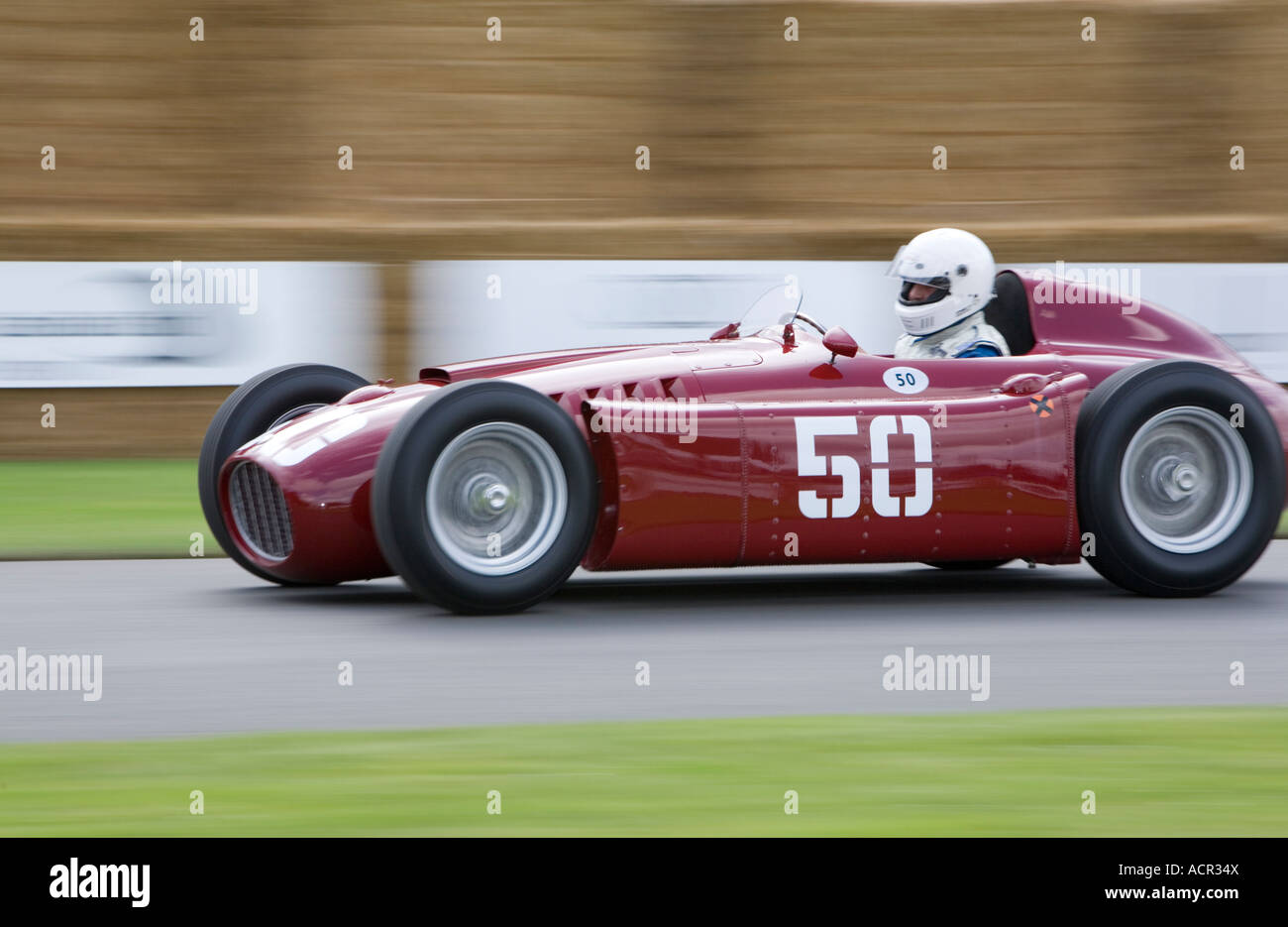 Classic one seater racing car and driver in motion Stock Photo