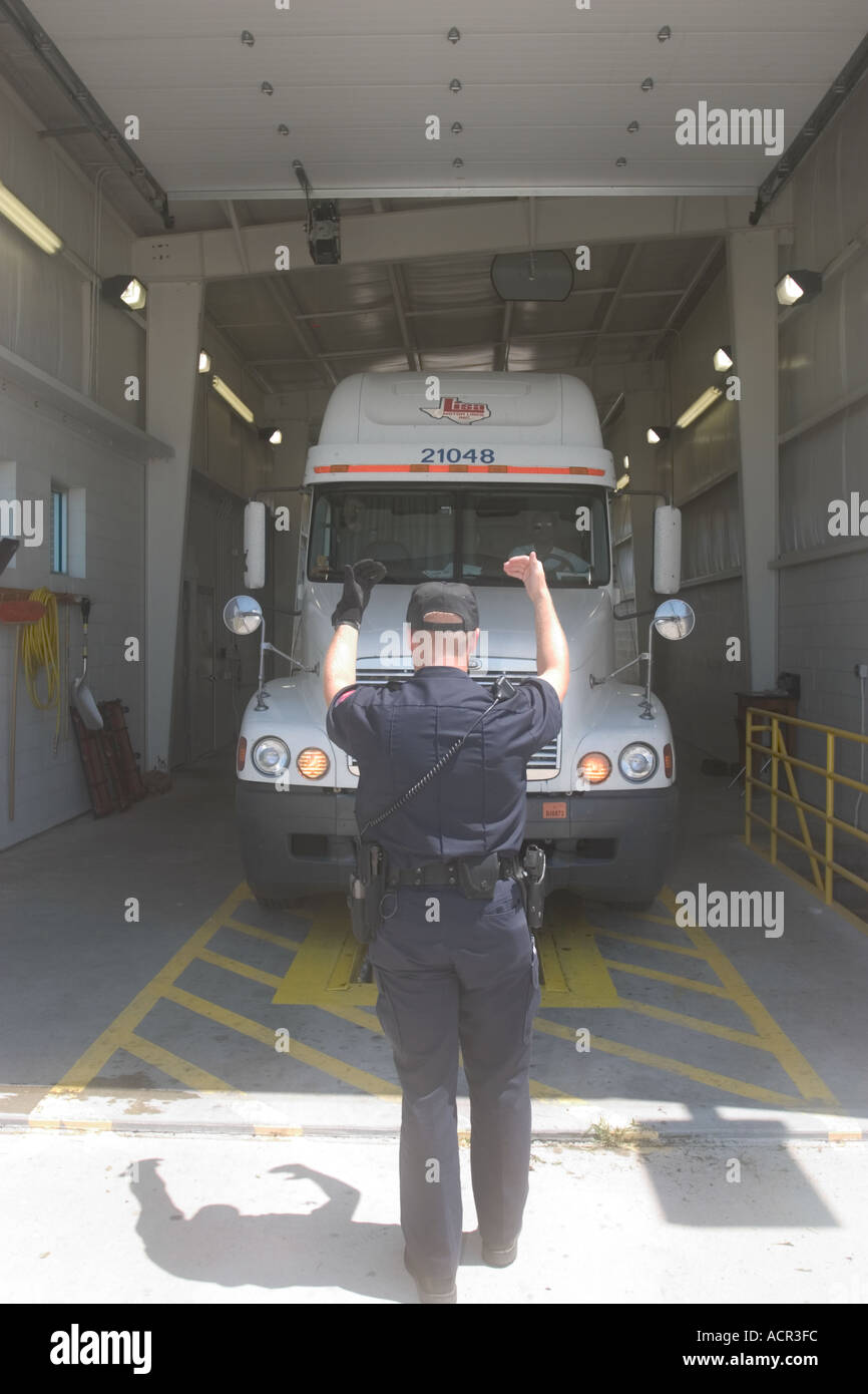 State Patrol Trooper inspects a commercial truck ( lorry ) at a weigh