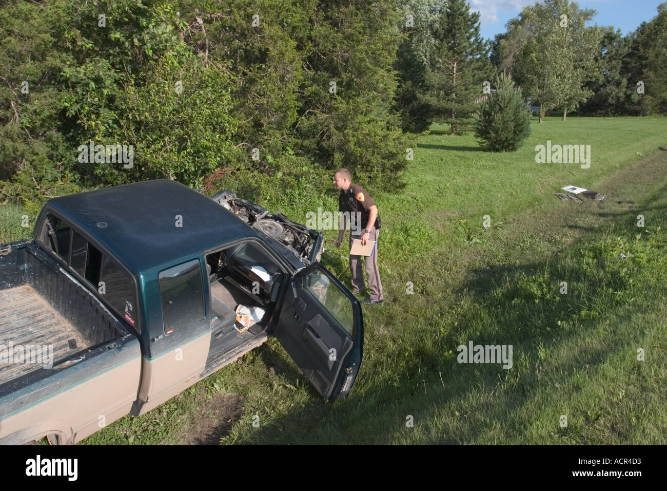 Deputy sheriffs at the scene of a traffic accident. Saline County