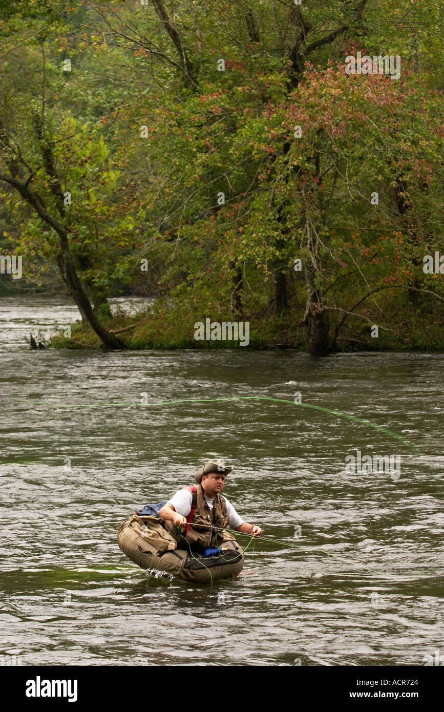 Fly Fisherman in float tube trout fishing the Hiwassee River Tennessee ...
