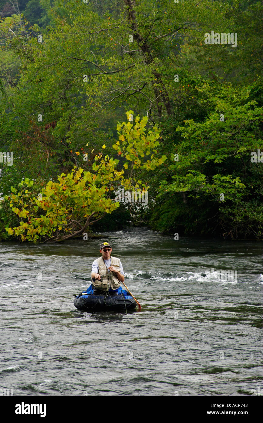 Fly Fisherman in float tube trout fishing the Hiwassee River Tennessee ...