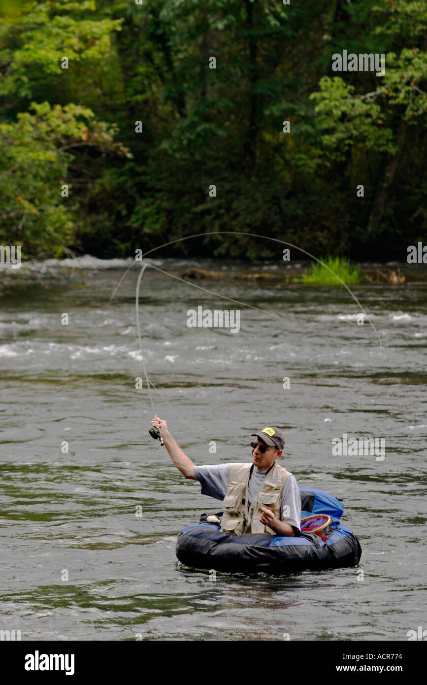 Fly Fisherman in float tube trout fishing the Hiwassee River