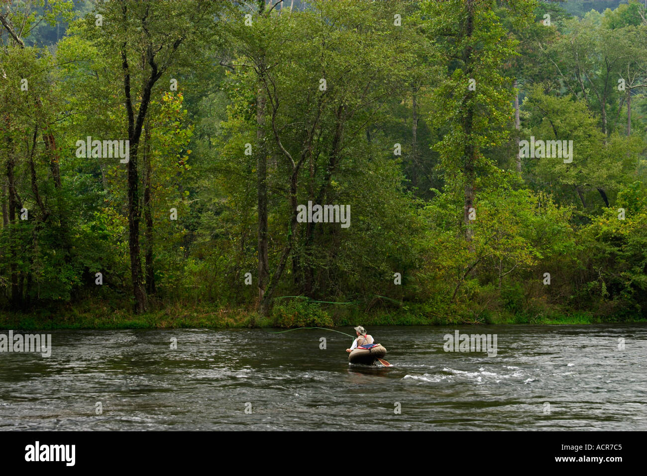 Fly Fisherman in float tube trout fishing the Hiwassee River Tennessee ...