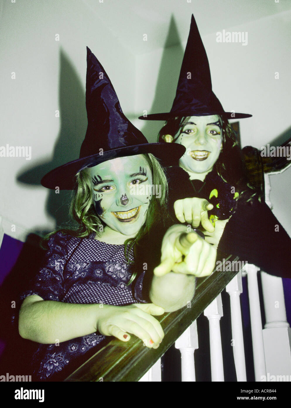 Girls aged 8 and 10 dressed as witches for halloween Stock Photo