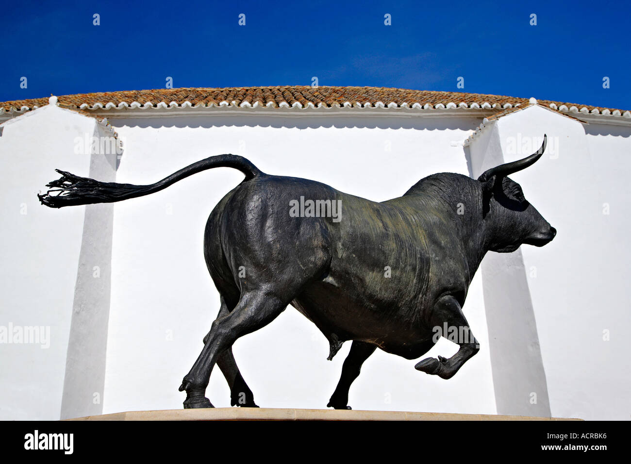 Statue of a bull in front the arena of Ronda, Andalusia, Spain Stock ...