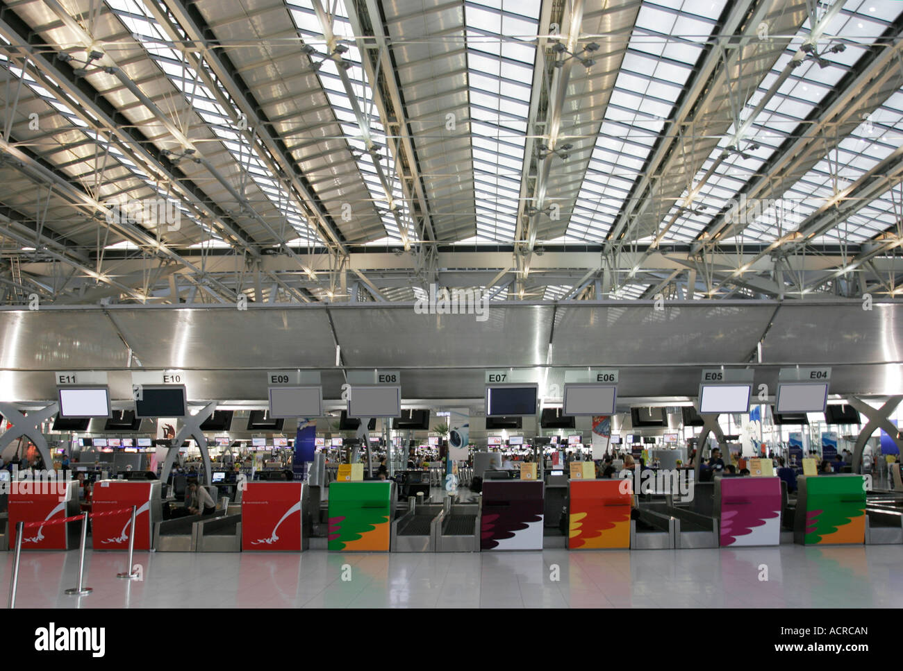International airport check in desks at Bangkok Thailand Stock Photo