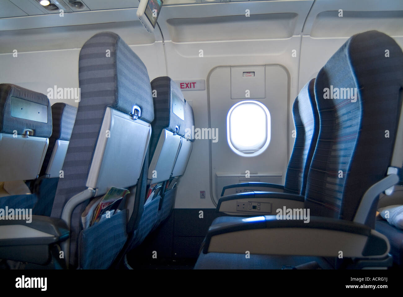 Empty Airplane Seats And Window On Commercial Airline Flight Stock