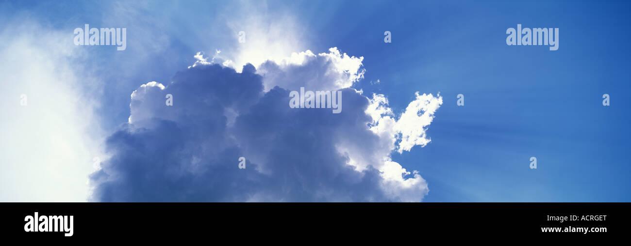 Sun behind cloud, sunbeams visible Stock Photo Alamy