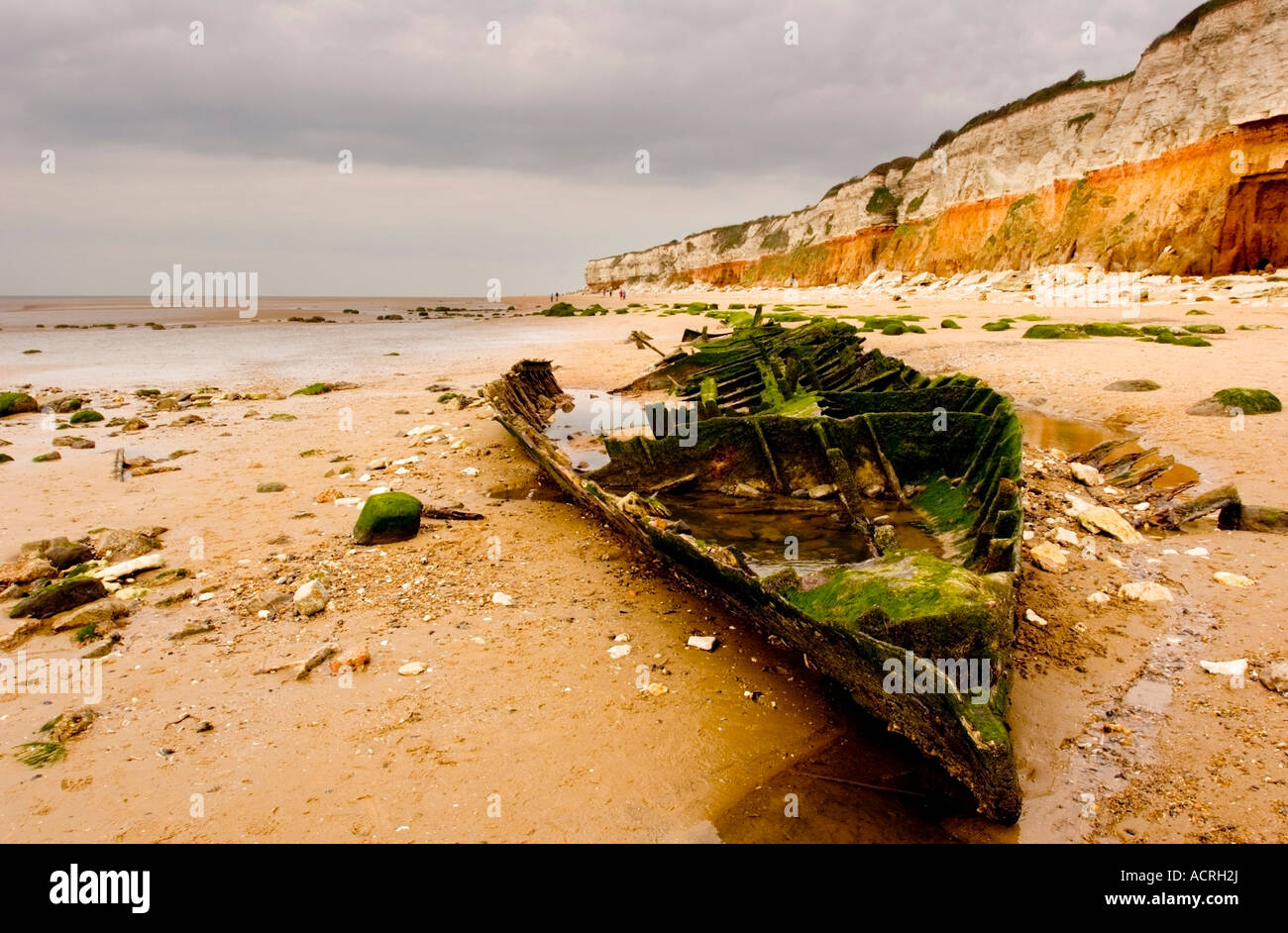 Hunstanton cliffs and beach showing a boat wreck in the sand Stock