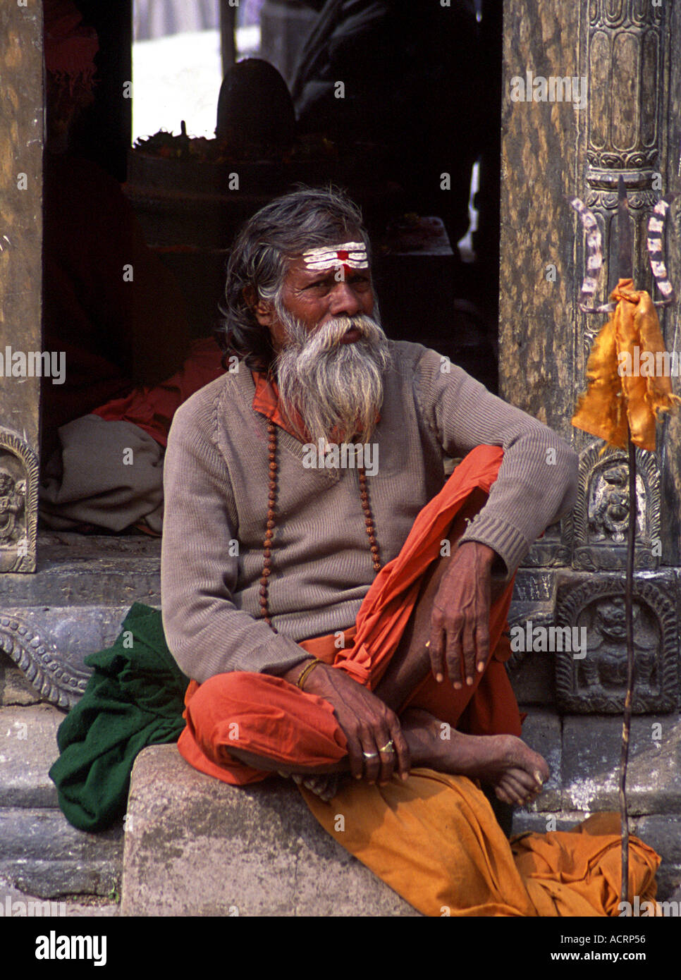 A sadhu warily eyes the camera at Pashupatinath during the festival of Shivaratri Nepal Stock Photo