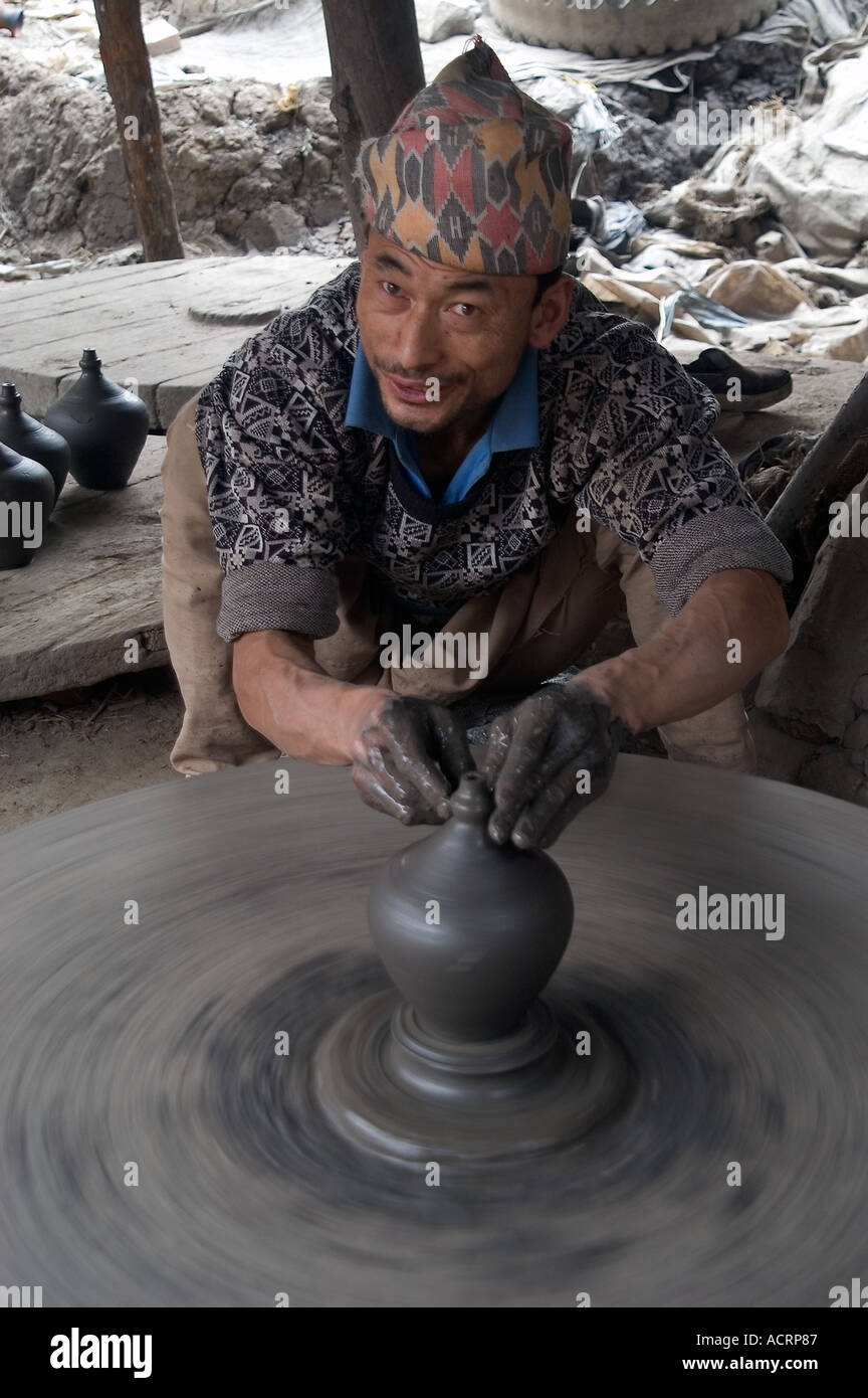 A potter spins his wheel in Bhaktapur s Pottery Square Kathmandu Nepal