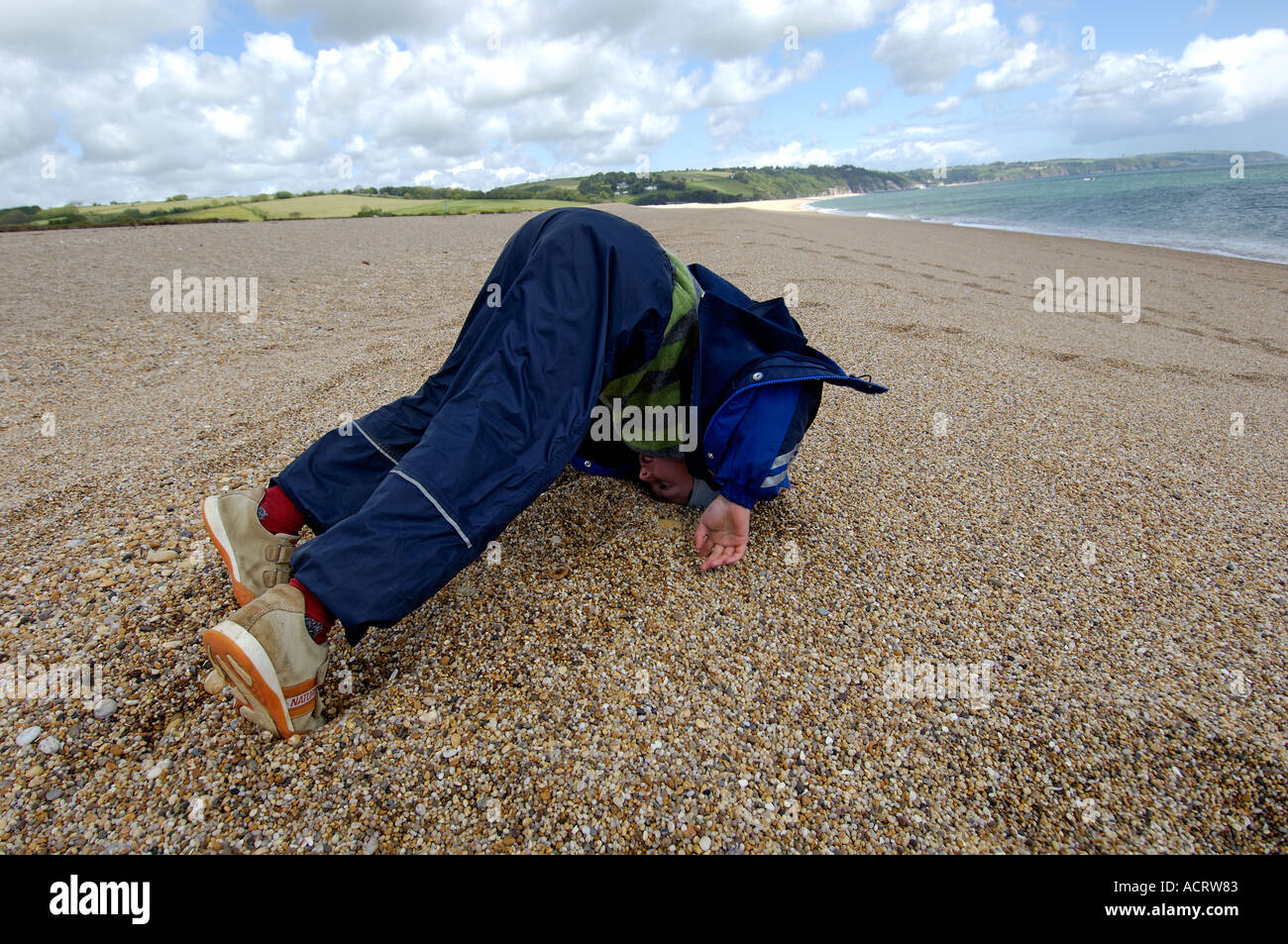 boy on the beach at Slapton Sands South Devon England Stock Photo