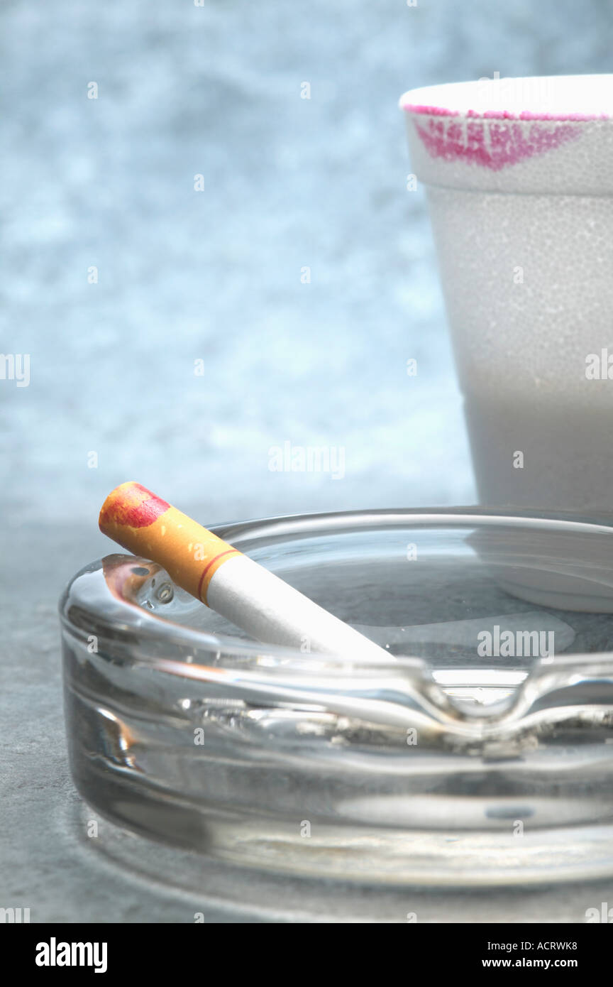cigarette with lipstick Plastic styrofoam cup and cigarette with lipstick marks Stock Photo