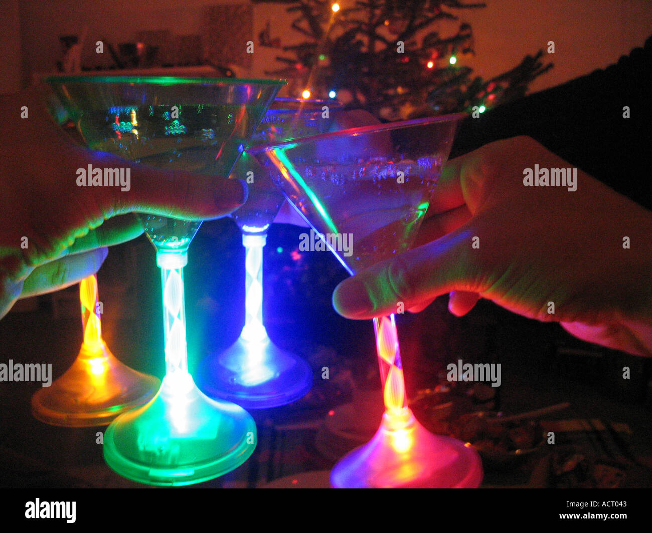 https://c8.alamy.com/comp/ACT043/christmas-toast-with-neon-stemmed-martini-glasses-ACT043.jpg