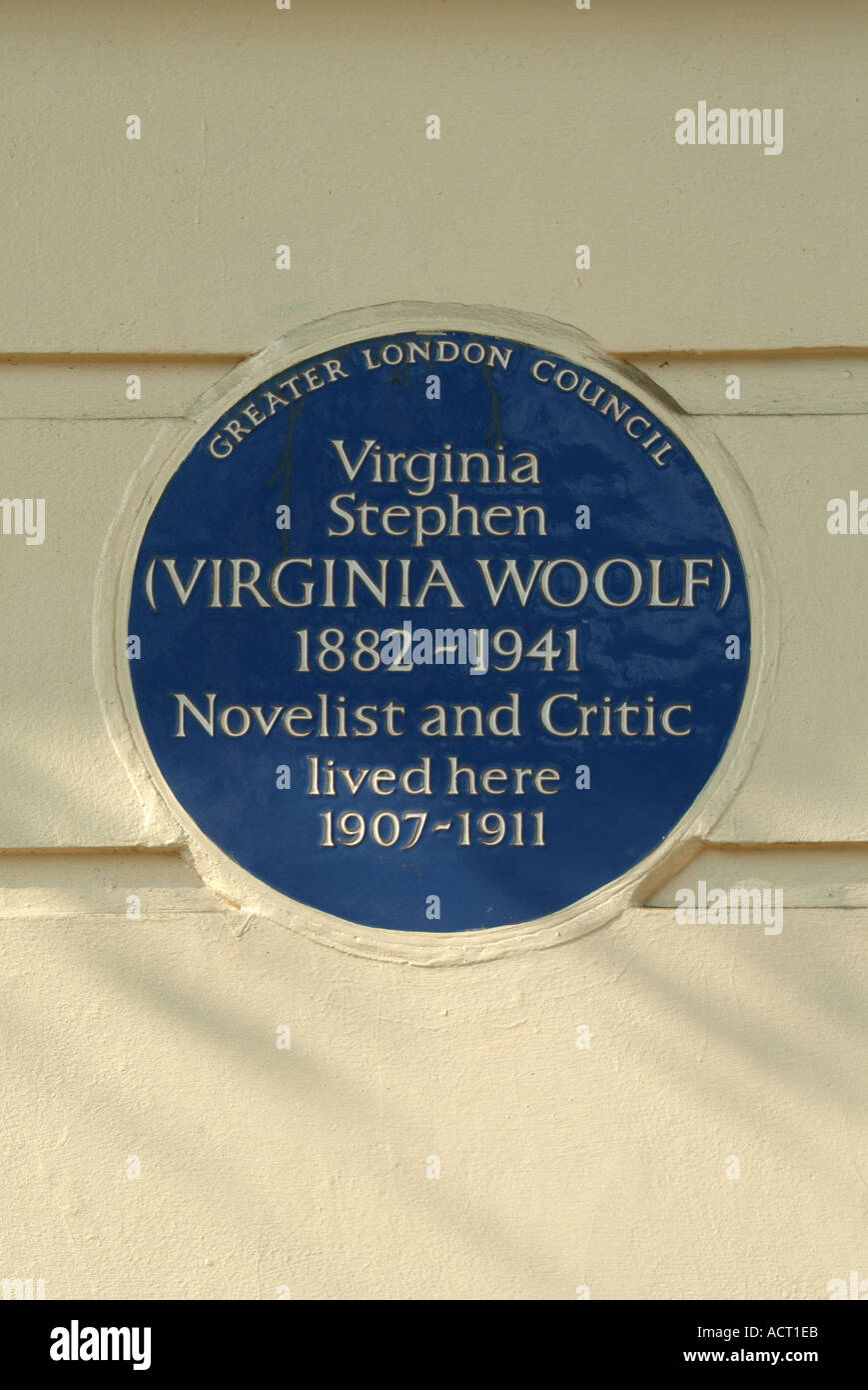 Historical blue information plaque on a Robert Adams building in Fitzroy Square recording occupied by Virginia Stephen 1882 - 1941 London England UK Stock Photo