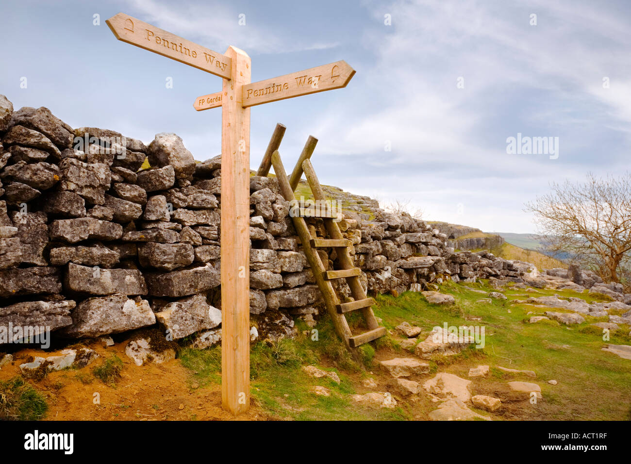 Stock Photo England sign for the Pennine Way at Malham Cove by stile over drystone wall Stock Photo