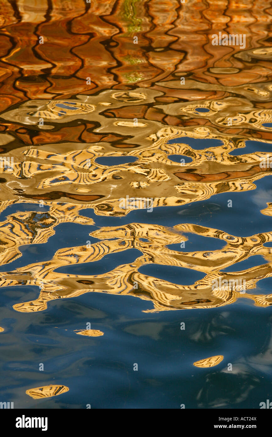 Reflections of boats in the sea Stock Photo - Alamy