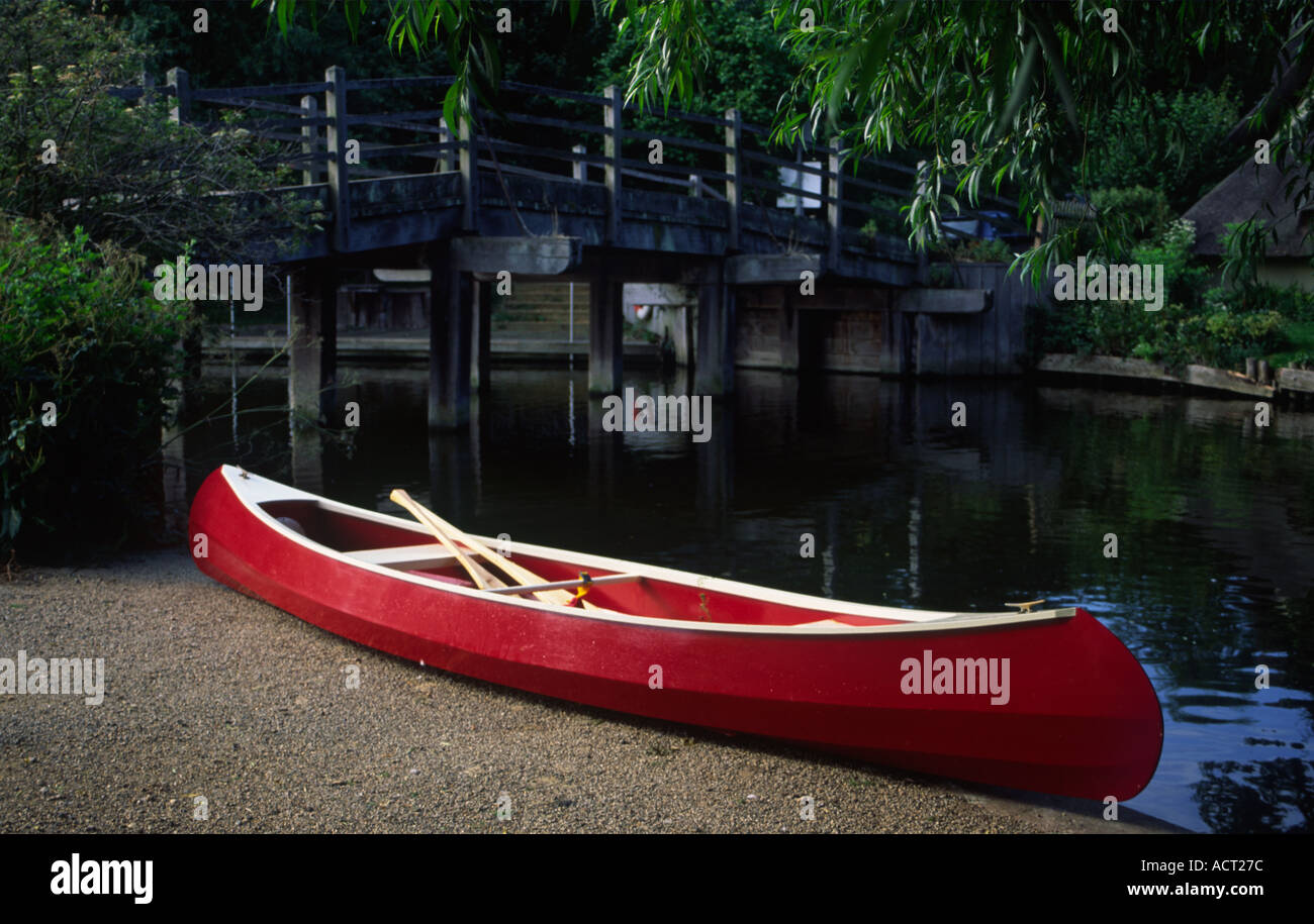 Canoe on the bank of the River Stour at Flatford Suffolk England Stock