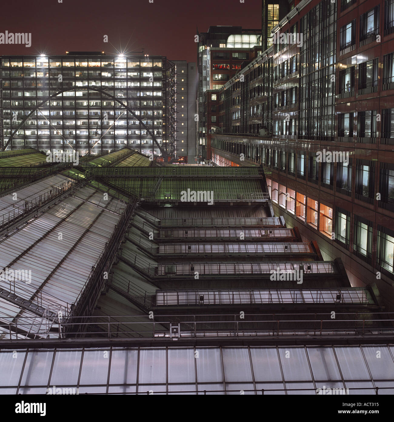 Night shot from above of Liverpool Street Train Station glass roof, London 2003; inc Bishopsgate and Broadgate office blocks Stock Photo