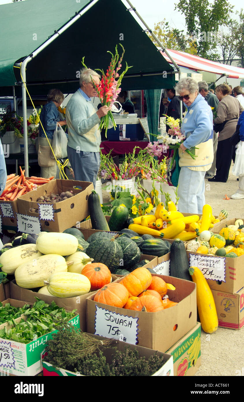 Buying produce and flowers at the Fort Garry Farmer's Market in