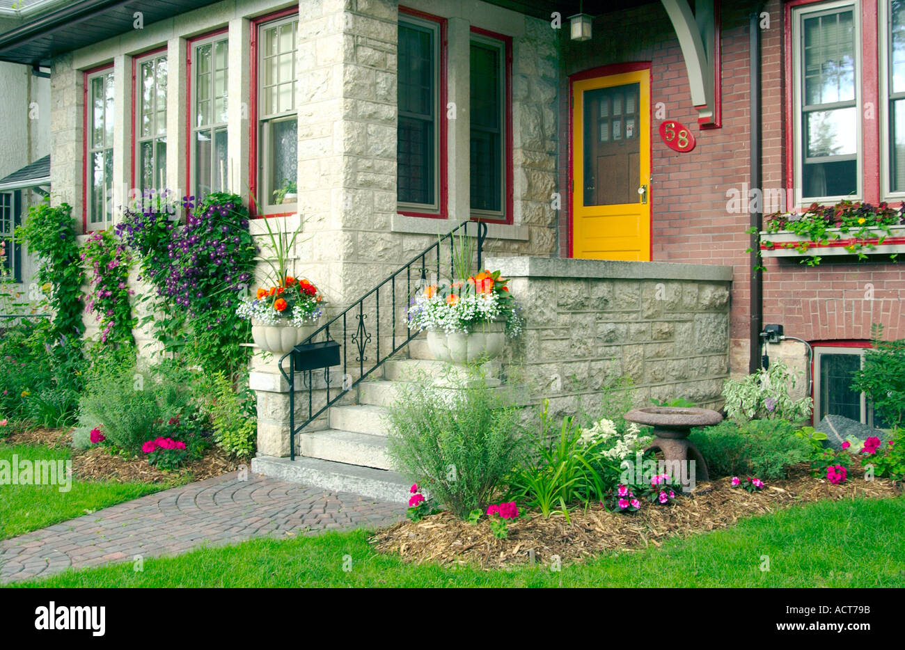 Inner city home exterior with flowers in Winnipeg Manitoba Canada Stock