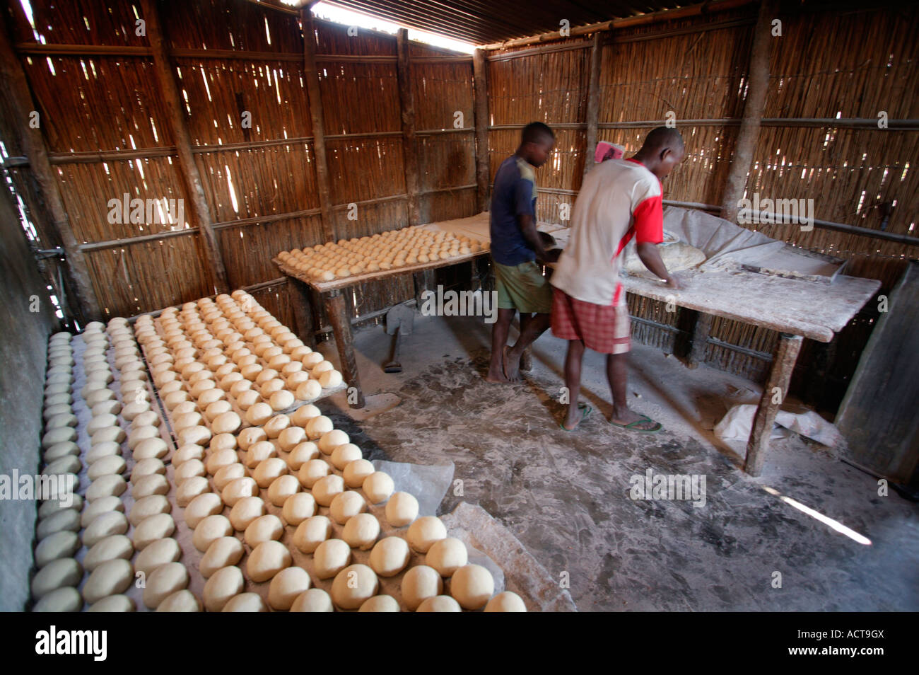 Bread dough laid out on baking trays in a rural bakery in Inhambane Barra Inhambane Province Mozambique Stock Photo