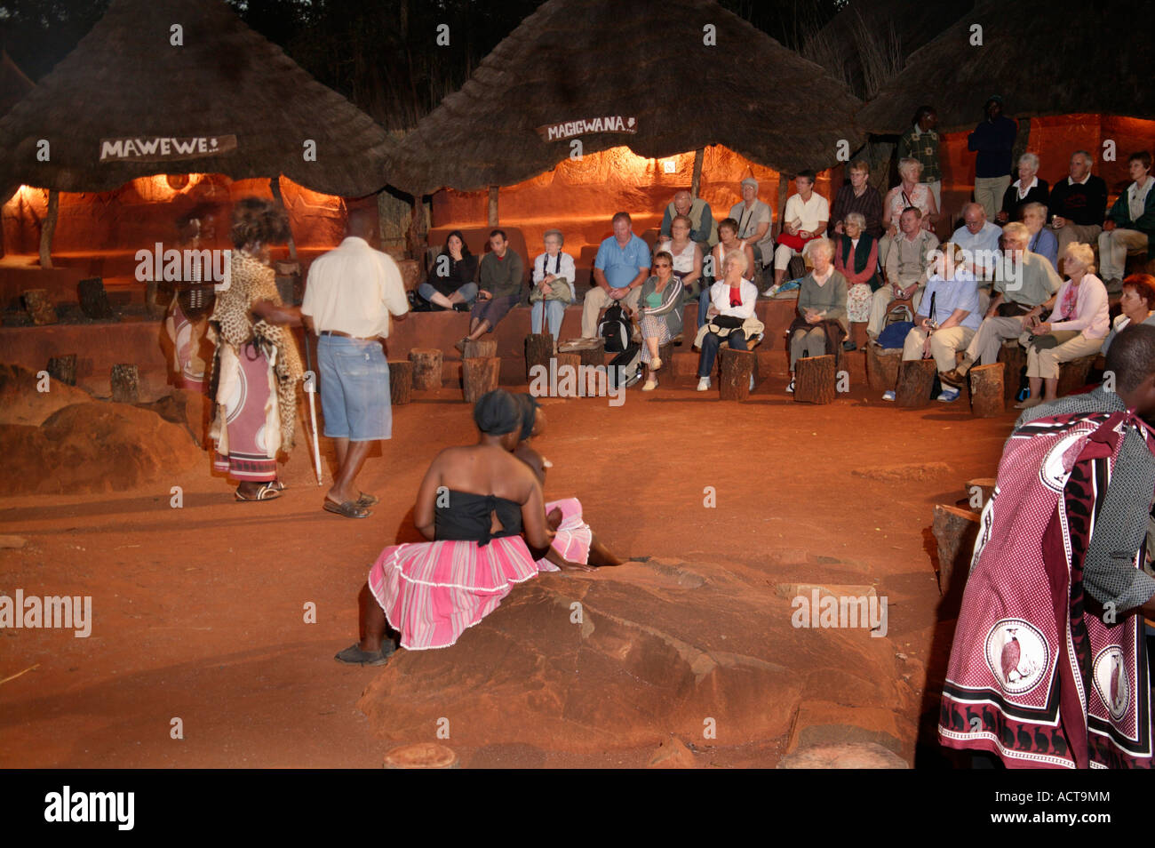 Tourists attending an evening dance show at the Shangana cultural village Hazyview Mpumalanga South Africa Stock Photo